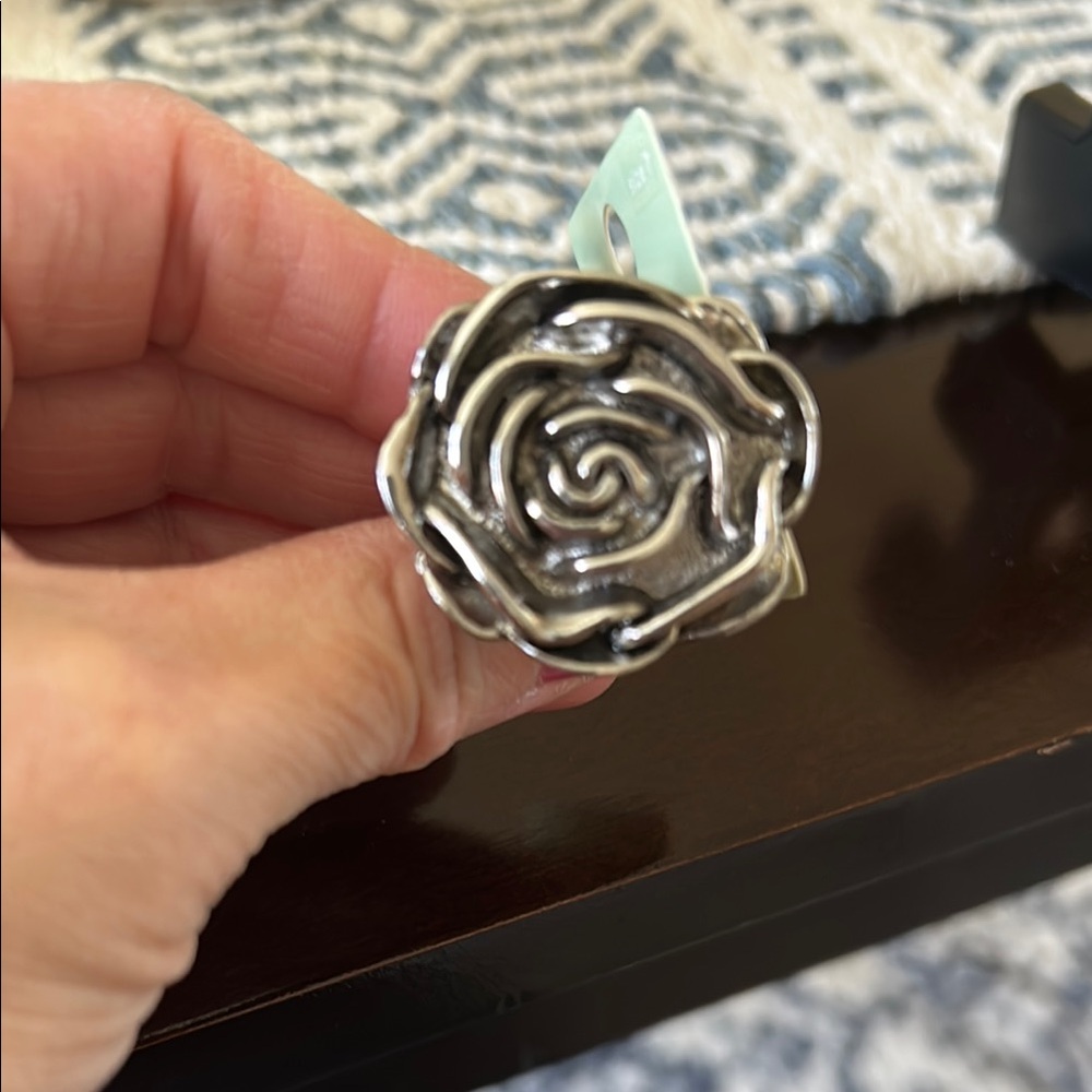 Vintage size 7 but new in package silver tone Rose ring.